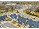 Aerial view of a community showcasing modern homes and a roundabout at 5229 Noble Village Way, Lilburn, GA 30047