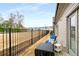 Back patio and fence with grassy area beyond at 5229 Noble Village Way, Lilburn, GA 30047