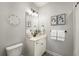 Stylish bathroom with white vanity, modern lighting, and decorative accents at 5229 Noble Village Way, Lilburn, GA 30047