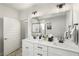 Elegant bathroom featuring a double sink vanity with black hardware and a glass-enclosed shower at 5229 Noble Village Way, Lilburn, GA 30047