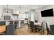 Contemporary dining area featuring a bar, a kitchen, and hardwood floors at 5229 Noble Village Way, Lilburn, GA 30047