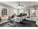 Well-equipped fitness center with treadmills, a mirror, and natural light at 5229 Noble Village Way, Lilburn, GA 30047