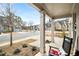 Relaxing front porch featuring classic rocking chairs with a view of the neighborhood street at 5229 Noble Village Way, Lilburn, GA 30047