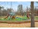 Community playground featuring colorful play structures, slides, and climbing areas in a well-maintained park setting at 5229 Noble Village Way, Lilburn, GA 30047