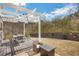 Backyard deck with pergola and a patio set, perfect for outdoor entertaining at 690 Floral Pl, Suwanee, GA 30024