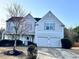 Charming two-story home with a well-manicured lawn and a two-car garage at 690 Floral Pl, Suwanee, GA 30024