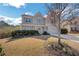 Charming two-story home with a well-manicured lawn, beautiful landscaping, and an inviting front porch at 690 Floral Pl, Suwanee, GA 30024