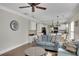 Open-concept living room flowing into a modern kitchen, perfect for entertaining guests at 690 Floral Pl, Suwanee, GA 30024