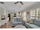 Comfortable living area connected to the kitchen, bathed in natural light and offering a seamless flow at 690 Floral Pl, Suwanee, GA 30024