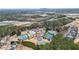 Aerial view of community amenities: tennis courts, pool, and clubhouse at 916 Santa Anita Dr, Woodstock, GA 30189