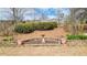 Landscaped backyard with retaining wall and birdbath at 916 Santa Anita Dr, Woodstock, GA 30189