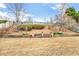 Backyard with terraced retaining wall, mulched garden beds and winter grass at 916 Santa Anita Dr, Woodstock, GA 30189