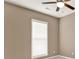 Bedroom highlighting a ceiling fan and bright window at 916 Santa Anita Dr, Woodstock, GA 30189