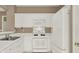 Bright kitchen featuring white appliances and ample counter space at 916 Santa Anita Dr, Woodstock, GA 30189