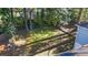 Backyard view with lush green grass and mature trees, enclosed by fencing for privacy, and foliage at 1270 Graymont Sw Dr, Atlanta, GA 30310
