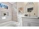 Bathroom featuring modern fixtures, a tub and shower, and stylish vanity at 1270 Graymont Sw Dr, Atlanta, GA 30310