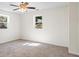 Bedroom with neutral carpet, ceiling fan, and natural light from two windows at 1270 Graymont Sw Dr, Atlanta, GA 30310