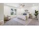 Bright bedroom featuring neutral decor, a ceiling fan, and an upholstered bed with a decorative rug at 1270 Graymont Sw Dr, Atlanta, GA 30310