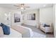 This bedroom features neutral decor with art, and a cozy sitting area near the bed at 1270 Graymont Sw Dr, Atlanta, GA 30310