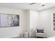 This bedroom features neutral decor, art on the walls, and a cozy sitting area near a window at 1270 Graymont Sw Dr, Atlanta, GA 30310