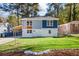 Beautiful two-story home showcasing a well-manicured lawn, lovely landscaping, and modern exterior finishes at 1270 Graymont Sw Dr, Atlanta, GA 30310