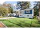 Charming two-story home featuring a lush green lawn, inviting curb appeal and modern exterior paint at 1270 Graymont Sw Dr, Atlanta, GA 30310