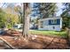 Charming two-story home with a lush front yard and mature trees at 1270 Graymont Sw Dr, Atlanta, GA 30310