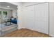 Hallway with hardwood flooring leads to a living space with carpet and bi-fold closet at 1270 Graymont Sw Dr, Atlanta, GA 30310