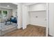 Hallway with hardwood floors leads to a carpeted living space and the laundry closet at 1270 Graymont Sw Dr, Atlanta, GA 30310