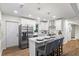 Bright kitchen features stainless appliances, island with seating, and white cabinets at 1270 Graymont Sw Dr, Atlanta, GA 30310