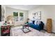 Inviting living room offers natural light, modern décor, and comfortable blue sofa at 1270 Graymont Sw Dr, Atlanta, GA 30310