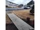 View of the Townhome community with lush greenery, mature trees, and ample parking for residents at 1625 Conley Rd # 171, Conley, GA 30288
