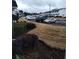 Serene view of townhome community with sidewalks and street parking, landscaped with bushes and lawn at 1625 Conley Rd # 171, Conley, GA 30288