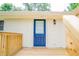A beautiful blue door with window on a newly constructed wood deck at 1975 Glenmar Dr, Decatur, GA 30032