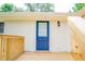 Back porch with wooden deck leading to the entrance of the home at 1975 Glenmar Dr, Decatur, GA 30032