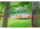 Backyard with a wooden deck and stairs on a white brick house at 1975 Glenmar Dr, Decatur, GA 30032