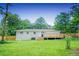 Large backyard of home with freshly cut green grass at 1975 Glenmar Dr, Decatur, GA 30032