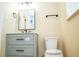 Bathroom featuring a marble top vanity, new toilet, and modern fixtures at 1975 Glenmar Dr, Decatur, GA 30032