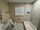 Modern bathroom features new vanity, toilet, shower, and tub at 1975 Glenmar Dr, Decatur, GA 30032