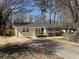Single-story home with a freshly painted exterior and a well-manicured front lawn at 1975 Glenmar Dr, Decatur, GA 30032