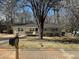 Charming home with a well-maintained front yard and mature tree at 1975 Glenmar Dr, Decatur, GA 30032