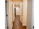 Bright hallway with hardwood floors, recessed lighting, and neutral wall paint at 1975 Glenmar Dr, Decatur, GA 30032