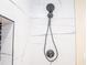 Modern shower featuring stylish white tiling with dark fixtures at 1975 Glenmar Dr, Decatur, GA 30032