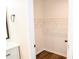Bright walk-in closet with hanging shelves and hardwood floors at 1975 Glenmar Dr, Decatur, GA 30032