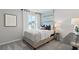 Cozy bedroom with a neutral color scheme, comfortable bed, and stylish decor at 3071 Birdsong Ave, Covington, GA 30016
