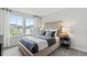 Comfortable bedroom with a plush bed, bright natural light, and neutral decor at 3071 Birdsong Ave, Covington, GA 30016