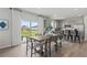 Bright dining area with a modern table, seating for six, sliding glass doors, and an open layout at 3071 Birdsong Ave, Covington, GA 30016