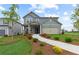 Charming two-story home with a welcoming front porch, landscaped yard and a two-car garage at 3071 Birdsong Ave, Covington, GA 30016
