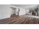 Spacious open-concept kitchen and living room with hardwood floors and stainless steel appliances at 3071 Birdsong Ave, Covington, GA 30016