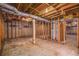 Unfinished basement with exposed framing, concrete floor, and utility lines at 6276 Willowbrook Dr, Riverdale, GA 30296